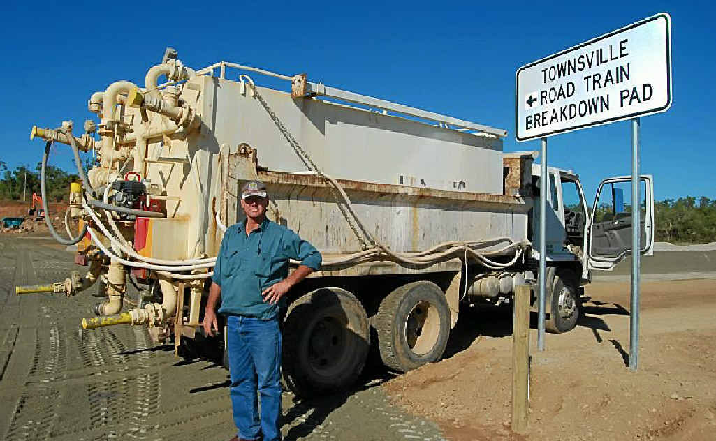 NEW FACILITY: Larry Kiernan stands near his water truck after uncovering the sign at the new breakdown facility. NEW FACILITY: Larry Kiernan stands near his water truck after uncovering the sign at the new breakdown facility.